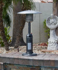 Portable Tabletop Patio Heater With 11,000 BTU Propane Output, Adjustable Heat Levels, Anti Tilt, Hammered Silver Finish in outdoor setting