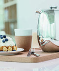 Thermal French Press Coffee Maker 51 Oz Double Wall Stainless Steel Insulated Plunger with waffles and coffee cup on cork tray.