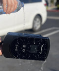 Smart Level 2 EV Charger For Europe And Asia Type 1 J1772 US Ready with water pouring on display, showing water resistance.