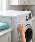 Child reaching for Adhesive Power Button Cover Kit, 2 Pack 41mm ID Flip Top Switch Panel Protectors on washing machine