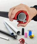 Hand using Pipe Cutter For Plastic Pipes 20 To 50 mm That Cuts Without Shavings, Ergonomic Handle near various pipes and spare blades