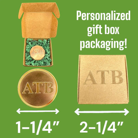 Personalized Golf Ball Marker Set Of 2 In Solid Brass And Copper With Knurled Edges Engrave Up To 20 Characters Durable American Made Metal Perfect Golf Gifts For Men Customizable Ball Markers For Serious Players, displayed in gift box packaging with engraved initials 'ATB' and size markings.
