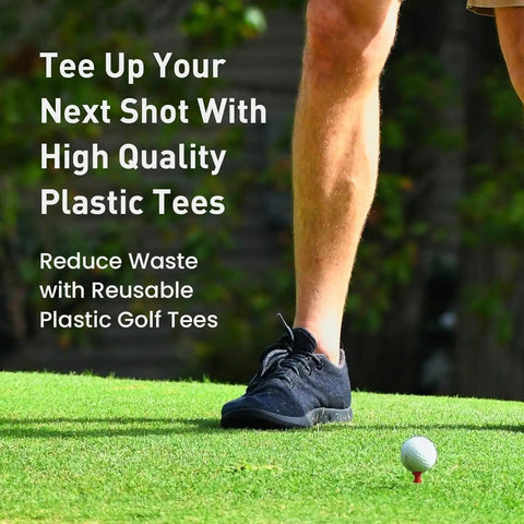 Person using Step Down Plastic Golf Tees Unbreakable 50 Pack One And A Quarter Inch 32 mm Red Reusable Castle Tees on grass