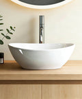 NUESTRA VIDA Overhead Sink Oval Ceramic 16.1 * 13 * 5.5 IN - Small Bathroom Hand Sink on wooden countertop with faucet.
