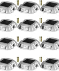 Solar LED Driveway Lights 16 Pack With Switch Waterproof Outdoor Pathway Markers For Garden Walkway Steps Wireless Dock Lighting 6 LEDs Bright Blue Glow For Nighttime Safety in a silver aluminum shell with screws.
