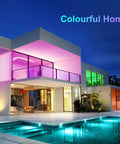 Contemporary house with vibrant lighting, showcasing flexibility of 16.4 Feet LED Light Strips With Remote And Power Supply Cuttable Flexible RGB Color Changing Dope Ambient Lighting For Bedroom Living Room Kitchen Decor With Easy Install Steps.