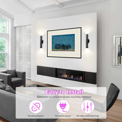 Modern living room with Battery Powered Wall Sconce Dual Pack With Motion Sensor, black finish, mounted beside artwork.