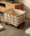 Heavy Duty Rolling Storage Basket For Toys, Smooth Swivel Caster Wheels Organizer With Removable Canvas Liner in black iron frame.