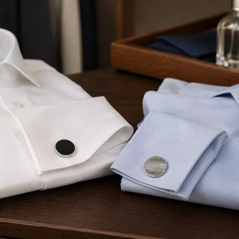 Two Pair Silver Plated French Cufflinks For Men Highlighting Smooth Black Enamel Disks And Crisp Grid Mesh Patterns on white and blue dress shirts.