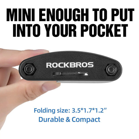 Close-up of a hand holding a 16 In 1 Foldable Bike Tool Kit For Cyclists, Portable Multitool with Allen Wrenches, compact size shown.
