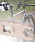 Totally Dead Nuts Precise 8mm Cycling Disc Brake Wrench And Cable Adjuster Tool with hexagon design on a bike.
