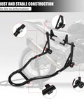 Universal Front Combo Wheel Fork Paddock Stand Lift For Motorcycles displayed in black powder-coated iron next to sport bike.