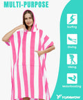 Woman wearing pink and white Hooded Surf Poncho Towel For On The Go Privacy Women Men Changing Robe with front kangaroo pocket.