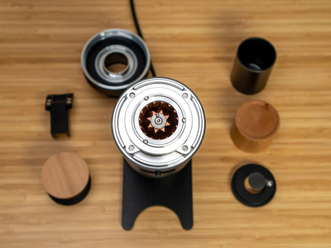 Solid Single Dose Coffee Grinder Featuring 63Mm Red Titanium Conical Burrs And Plasma Ionizer To Crush Beans Sick Flat And Eliminate Static Drama For Flawless Pulls In Sleek Black Housing, top view with components.