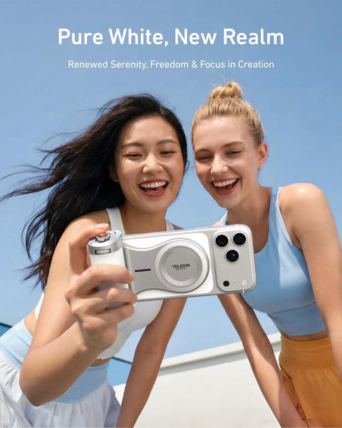 Two women smiling holding a Magnetic Imaging Master Grip Boss Level Phone Camera Grip With 3200mAh Battery Wireless Shutter Button