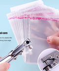 7mm Single Hole Punch For Paper Plastic Bags OPP PVC Bags Photos Cardboard Easy To Use For DIYers And Pros, shown in use
