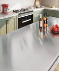 Kitchen countertop covered with Brushed Nickel Peel And Stick Stainless Steel Contact Paper For Appliances And Cabinets Kitchen DIY Wrap Cover Adhesive Decorative Film 15.8 X 78.8 Inch Removable Waterproof Oil Proof Scratch Resistant No Mess Easy To Install.