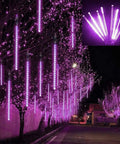 Meteor Shower Rain Lights 192 LED Icicle Strings, 8 Tubes Purple Outdoor Christmas Lights decorating trees at night; falling snow effect