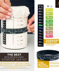 Ultimate Sourdough Starter Kit With Banneton Proofing Baskets 14 Piece Bread Making Set showing glass starter jar with tracker belt and thermometer guide.