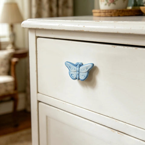 Blue butterfly knob from Six Piece Ceramic Drawer Knobs Set With Cute Butterfly Cabinet Pulls For Nursery And Kid Friendly Rooms Decorative Dresser Handles With Screws Ideal For Bedroom Bathroom And Shabby Chic Furniture Makeovers on white drawer