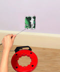 Using Wxtools 100 Ft Fish Tape For Electric Wire Pulling Reel with Durable Handle to pull wires from wall outlet.