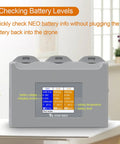 Three Channel Battery Charging Hub For Neo Drone Batteries With LCD Display showing battery status and voltage levels.
