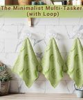 YUA microfiber cleaning cloths, green lemon pattern, set of three towels hanging on hooks.