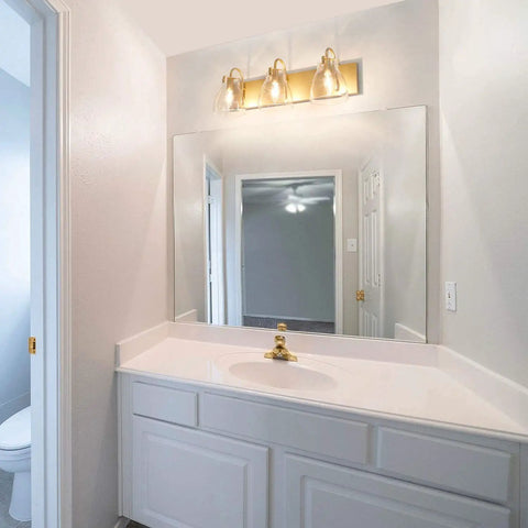 Bathroom with 3 Light Modern Vanity Light Fixture in Brass Finish With Clear Glass Shades For Bathroom, 22 Inch Long Wall Mount Vanity Lighting Bar above the mirror