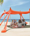 Beach Tent Sun Shelter 10x10ft UPF50 Plus Portable Shade Canopy Orange with people enjoying shade on beach