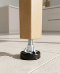 Close-up of furniture leg with Adjustable Furniture Leveling Feet Kit 12 Pcs With T Nuts And Anti Slip Pads 1/4 Inch Thread.