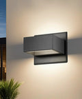 Outdoor Up Down Wall Light Fixture LED Porch Wall Lamp Modern Exterior Waterproof Aluminum Sconce mounted on wall at dusk.