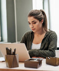 Woman using laptop with walnut wood sticky note holder and tape dispenser, rhombic pen holder desk organizer set nearby