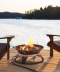 Portable Propane Fire Pit 21 Inch Smokeless Gas Firebowl With 58,000 BTU on wooden deck by lake, Adirondack chairs