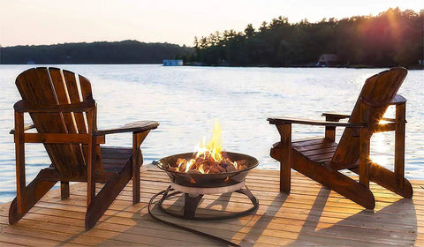 Portable Propane Fire Pit 21 Inch Smokeless Gas Firebowl With 58,000 BTU on wooden deck by lake, Adirondack chairs