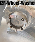 Close-up of Beefy 1 Inch Wheel Washers for 4x156mm Bolt Pattern with 3 eighth inch studs to 12mm wheels in use