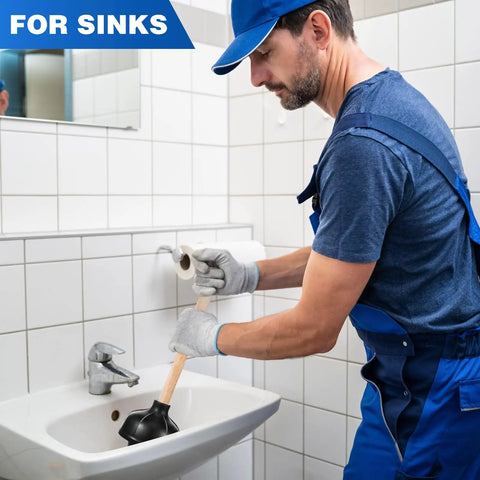 Man using Heavy Duty Wood Handle Black Toilet Plungers Bulk Pack of 10 to unclog a sink drain in a bathroom.