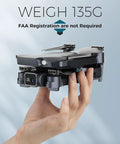 1080P FPV Drone With Camera For Kids And Adults, One Key Takeoff And Landing in hand showing compact size at 135g.