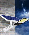 JUDYSSY Spot Lightingwall-Mounted Led Solar Street Lights mounted on a brick wall during a storm, showcasing its IP65 waterproof feature.