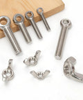 6 Sets M8 x 50mm Lifting Shoulder Eye Bolts With Wing Nuts Kit on wooden base, stainless steel components displayed