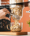 Triple Head Countertop Cereal Dispenser Delivering Hella Spacious 12 Liter Storage For Nuts Candy And Grains Built With A Rock Solid Steel Lid And Wooden Base Showing Silicone rotating blades dispensing grains into a glass bowl.