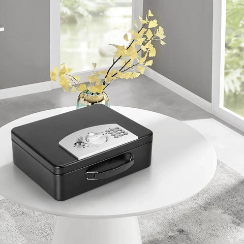 Heavy Duty Steel Safe Box With Digital Keypad Lock For Personal Items And Travel Security on table, includes carry handle.
