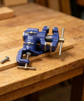 Heavy Duty Woodworking Bench Clamp With 360 Rotation For Pros, High Carbon Steel Vise on wooden table for workshop use.