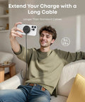 Man using Magnetic Wireless Charger Pad Qi2 Certified 15W MagSafe Compatible for iPhone with long cable on sofa