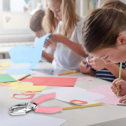 Kids using Handheld Paper Hole Punch Set With 1/16 Inch Small Circle And 1/8 Inch Medium Circle One Hole Punch Tool in a classroom.
