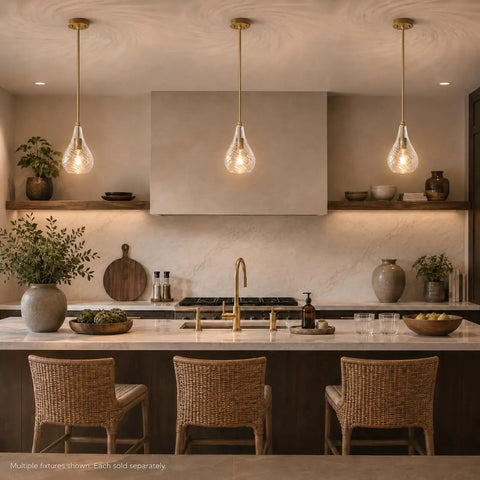 HXXLFONEDP Champagne Gold Pendant Light for Kitchen Island, Clear Glass in a modern kitchen setting over a countertop.