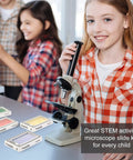 Girl using microscope with Ready To Go 48 Prepared Microscope Slides Set With Animals Insects Plants And Flowers for beginners