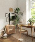 Living room with Sand Swirl Swell Removable Peel And Stick Wallpaper With Retro Curves, 20.5 In Wide, showing furniture and plants.