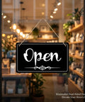 Double Sided Open Sign With Rope For Biz Hours Open Closed Sign 11 By 6.1 Inch Easy Flip Display hanging on a glass door