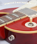 Close-up of Prewired 3 Way Toggle Harness for Les Paul Style Guitars Ready to Install on red guitar body with cream trim.