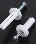 Close-up of one quarter by three inch plastic hammer drive nail anchors for concrete and masonry, 100 pieces per box.